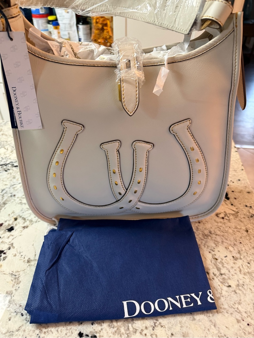 Dooney & Bourke Cream Florentine Leather Shoulder Bag with Horseshoe Accent